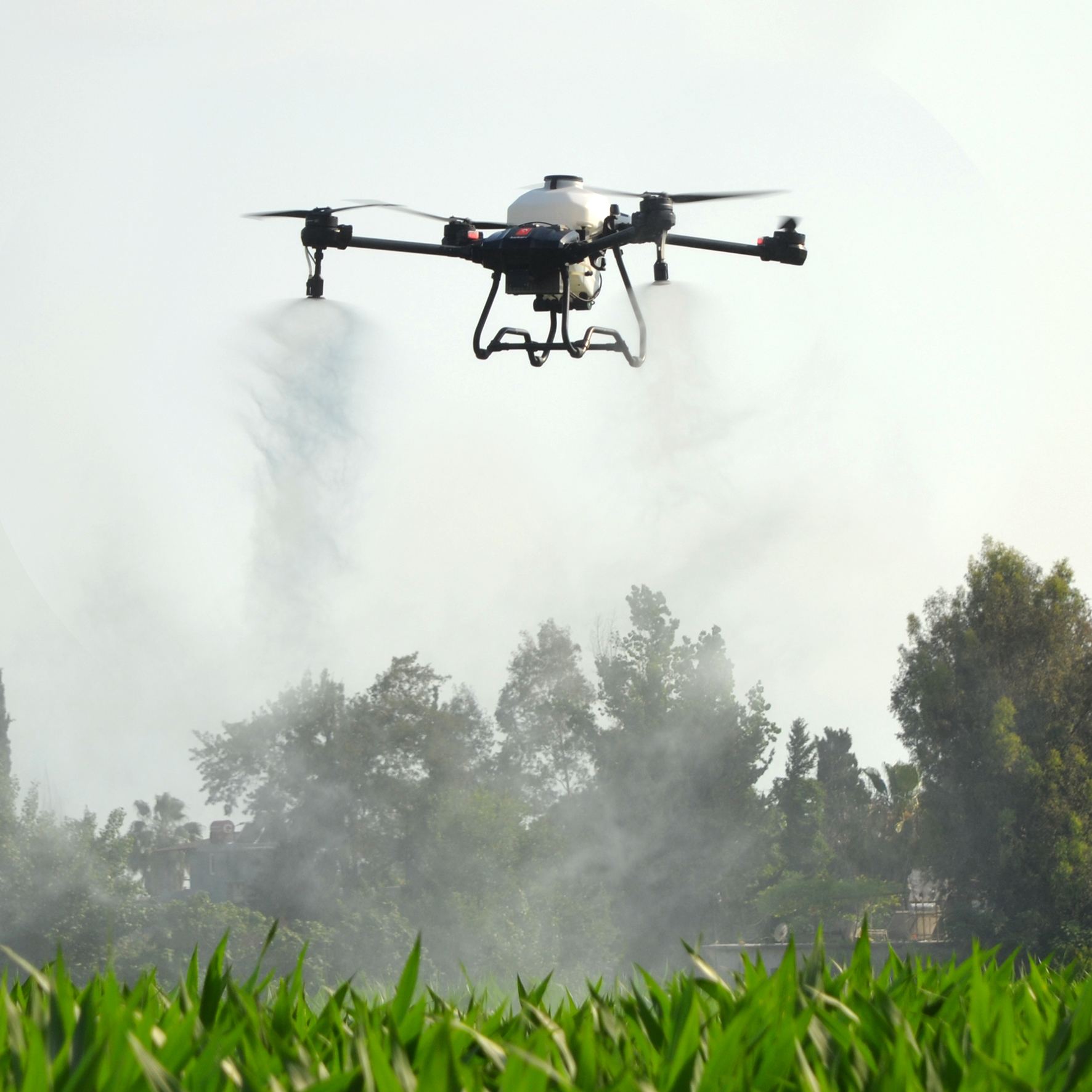 An agricultural drone spraying a crop